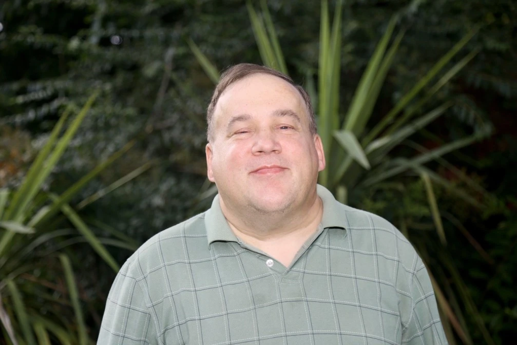 Disabled man smiling at camera