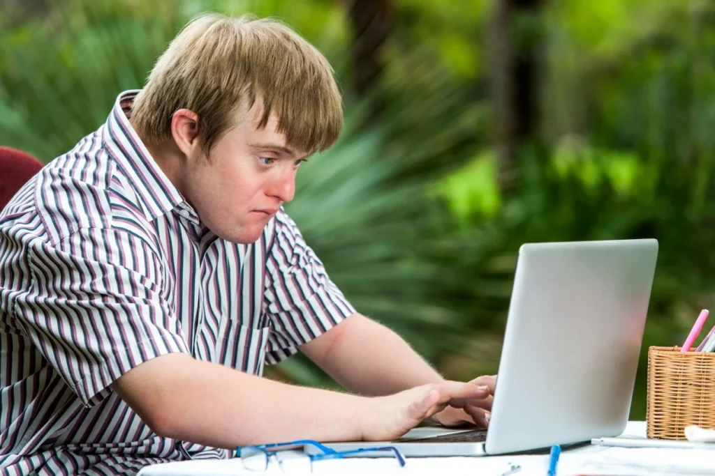 Disabled boy using laptop