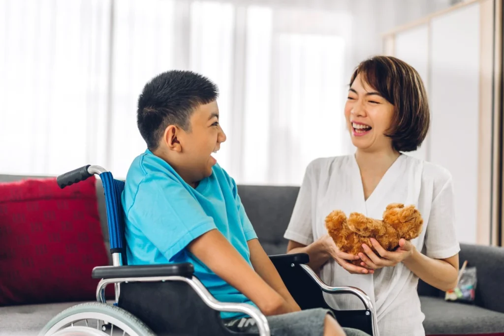 Disability nurse with NDIS participant in wheelchair